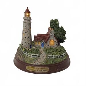 Thomas Kinkade "The Light of Peace" Lighted Lighthouse figurine.
